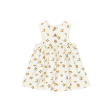 Load image into Gallery viewer, The Rylee & Cru Layla Dress is a sleeveless cream cotton jersey babydoll dress for kids, featuring a round neckline, gathered skirt, and an all-over oranges print with yellow and brown fruits and green leaves. Shown on a white background.