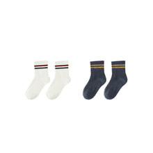 Load image into Gallery viewer, The 2-Pack Socks set includes two different styles: one pair in white with red and black stripes, and another pair in dark blue with yellow stripes, both classic striped designs displayed on a white background.