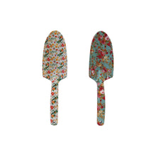 Load image into Gallery viewer, Creative Co-Ops Flowered Garden Tools: 2 Styles feature aluminum designs with colorful floral patterns—one white, one teal—perfect for brightening your gardening routine. Both tools are shown side by side on a white surface.
