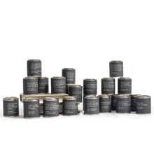 Load image into Gallery viewer, Lit Decor and Gift’s Legends Candles—Pick From 20 Quotes—are displayed in black jars with white text labels, arranged in tiers. Each vegan candle features a unique phrase. The background is plain white.