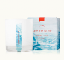 Load image into Gallery viewer, The Thymes Aromatic 8 oz Candle by Lit Decor and Gift, in a white glass jar labeled Aqua Coralline, stands beside its blue wave-adorned box. Its fresh, oceanic scent gently elevates your home with a clean burn and stylish design.