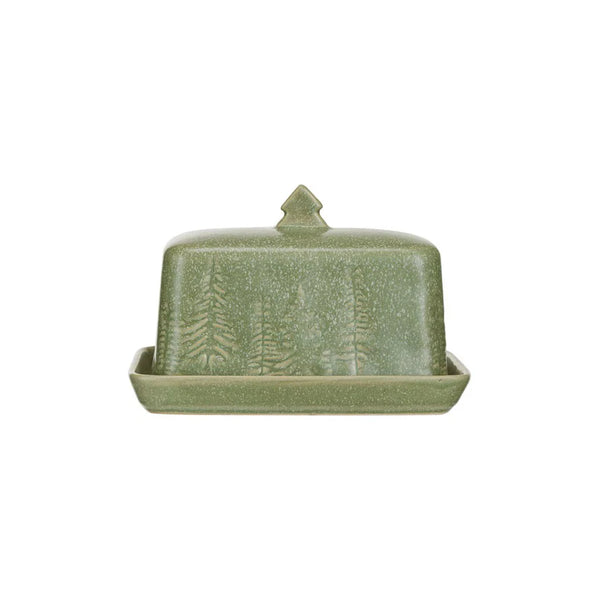 The Green Debossed Stoneware butter dish features a matte reactive glaze, a tree-shaped handle, and a debossed tree design on the lid, shown against a white background.