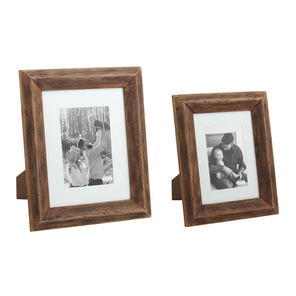 Two Reclaimed Matte Wood Frames with white mats showcase black-and-white family photos side by side for rustic decor, with the larger frame on the left and the smaller on the right.
