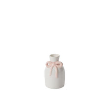 Load image into Gallery viewer, The Budvase w/ Bow is a small white ceramic vase with a narrow neck and a raised light pink bow on the front, ideal for spring event decor and displayed on a plain white background.