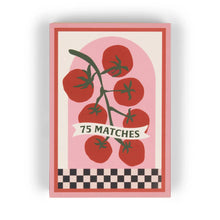 Load image into Gallery viewer, The A Dopo 75ct Boxed Matches feature a pink box with a vine of red tomatoes, a "75 SAFETY MATCHES" banner, and a checkerboard border, evoking Mediterranean travel vibes.