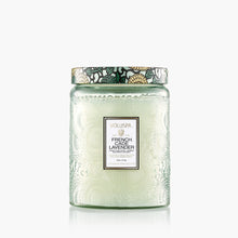 Load image into Gallery viewer, The Voluspa 18oz Glass Jar Candle features clean-burning coconut wax in an embossed glass jar with a floral-embellished lid, perfectly complementing the white candle inside.