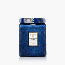 Load image into Gallery viewer, The Voluspa 18oz Glass Jar Candle features a large blue embossed design with a decorative lid, clean-burning coconut wax blend, hand-poured in the USA, and is part of the elegant Japonica Collection.