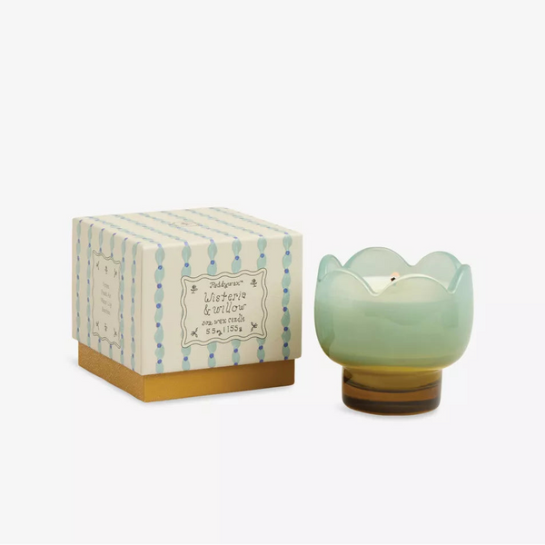 A pastel green, tulip-shaped glass candle holder with a white candle sits beside its decorative Paddywax "Boxed Tulip Glass Candle" box, both displayed against a plain white background.