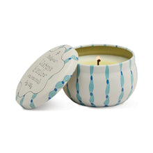 Load image into Gallery viewer, A lit Printed Tulip Candle Tin in a round, white and blue patterned container sits with its decorative lid beside it, hinting at fragrant notes like Cactus Flower or Bronzed Gardenia.