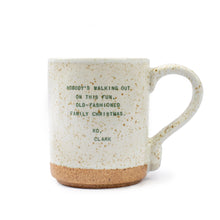 Load image into Gallery viewer, The Seasonal XO Mug is a speckled white ceramic mug with a natural brown base and green holiday quotes: NOBODY&#39;S WALKING OUT ON THIS FUN, OLD-FASHIONED FAMILY CHRISTMAS. XO, CLARK. Ideal for festive cheer and fans of oversized mugs!.