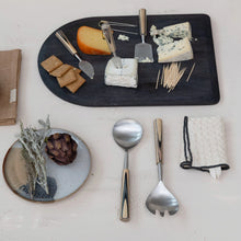 Load image into Gallery viewer, A cheese board with assorted cheeses, crackers, and toothpicks sits beside a plate with a purple artichoke and herbs. Three metal serving utensils and a folded S/3 Dish Cloths w/ Colored Edge are also arranged on the table.