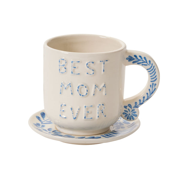 The Best Mom Mug/Saucer is a white ceramic mug with blue 