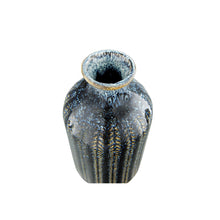 Load image into Gallery viewer, The Blue Stoneware Vase has a narrow opening and a textured striped pattern in dark blue, black, and tan, shown from above on a white background.