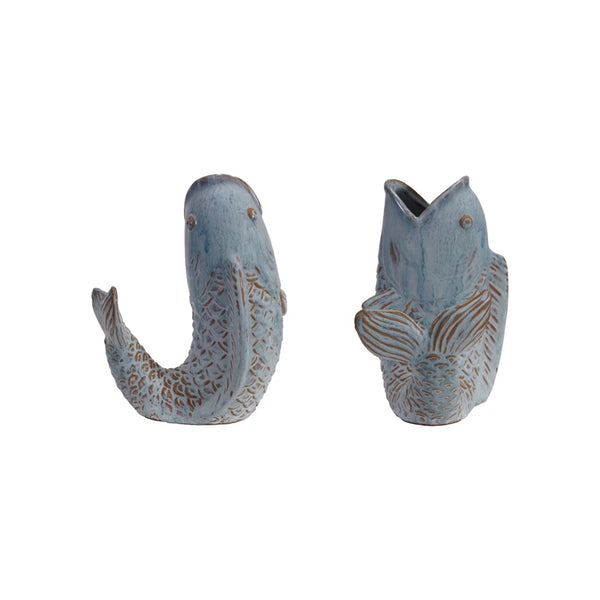 The Fish-Shaped Vase is a handcrafted ceramic piece with textured scales and fins, glazed in light blue. Shown from side and front angles against a white background, it's ideal for coastal home decor.