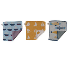 Load image into Gallery viewer, The Fish/Boat Pattern Knit Dishcloth set includes three styles: blue with boats, yellow with white sailboats, and blue with yellow fish. Each dishcloth is shown partly folded—ideal for adding coastal charm to your kitchen décor.