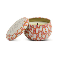 Load image into Gallery viewer, The Printed Tulip Candle Tin features a peach and white geometric design in a round tin with matching lid beside it. The unused candle has a centered wick and is ready to fill your space with the Bronzed Gardenia fragrance.
