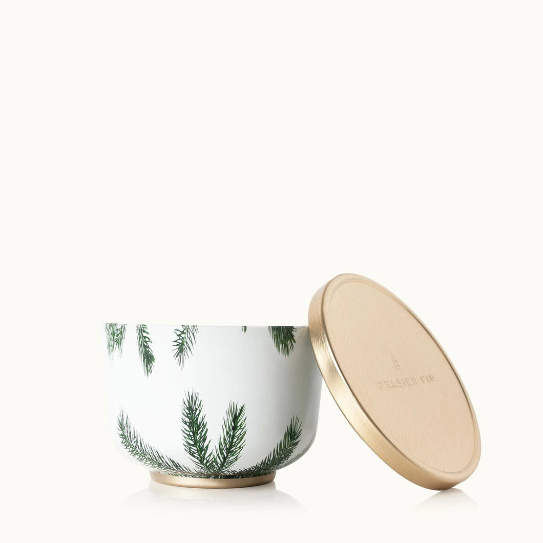 The Frasier Fir Heritage Collection features a white candle jar with green pine branch designs and a gold lid, evoking the crisp winter scent—ideal for pairing with reed diffusers to refresh your space.