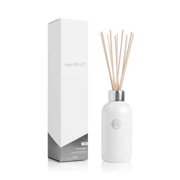The Volcano Reed Diffuser features a white bottle with a silver cap and multiple reed sticks, paired with sleek white and silver packaging—an ideal flameless fragrance option to enhance any modern home décor.