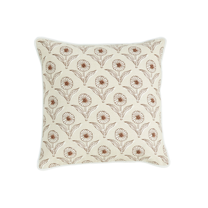 Mudpies Block Print Flower Knot Pillow, available in 2 styles, features a square beige design with a repeating brown floral pattern and elegant white piping, displayed on a plain white background.