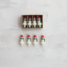 Load image into Gallery viewer, The Box/4 Shaped Candles features festive snowman-shaped, unscented candles with red hats, beautifully arranged in an open box—perfect for adding holiday cheer to your décor.