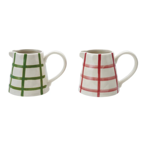 Two small Hand Painted Stoneware Creamers with a grid pattern—one with green lines, the other red—both crafted from white stoneware.