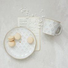 Load image into Gallery viewer, A plate from the Tree Debossed Stoneware collection with cookies rests beside an artisanal mug and a handwritten note.